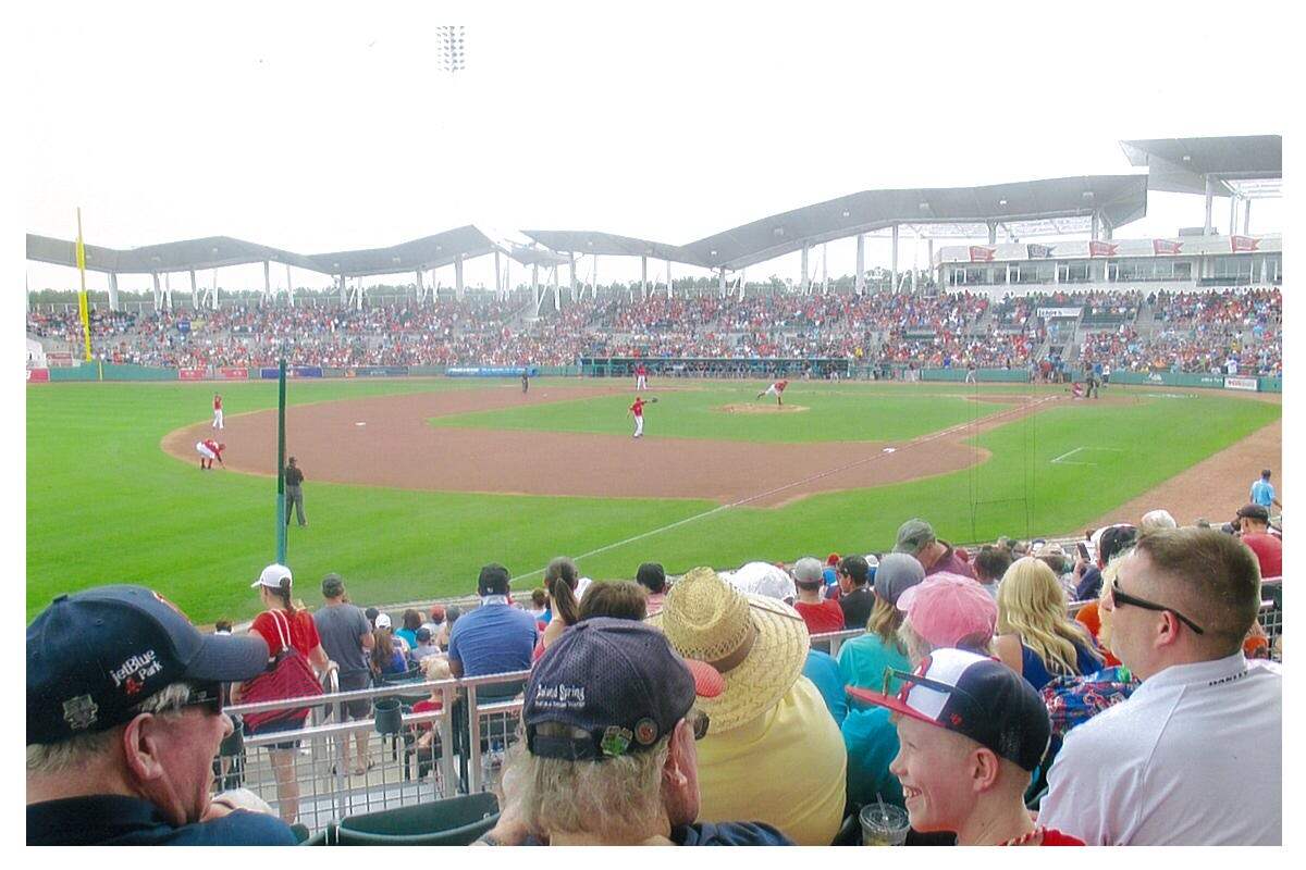 A crowd looks at Boston Red Sox players in JetBlue Park, Florida. 