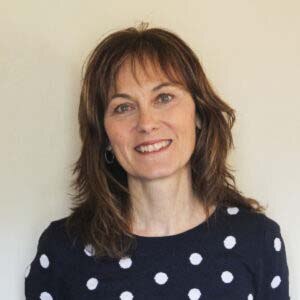 Portrait of Vice President of Human Resources Kathleen D. Salois, a middle-aged woman with a light skin tone and shoulder-length brown hair.