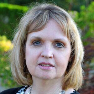 Portrait of Assistant Vice President of Family Based Living Program Terri Presby, a middle-aged woman with a light skin tone and blond, chin-length hair.